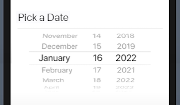 Center Section Of Mobile Device Shown With Date Picker Element Displaying Prompt To Pick A Date And Slidable Sections To Change Month, Day, And Year