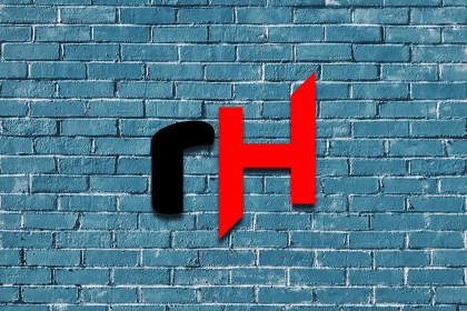 Rehackt logo over a blue brick wall.