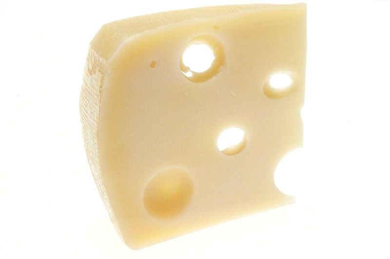 Image of Swiss cheese used to symbolize the gaps in a JavaScript array when non-sequential keys are assigned.